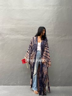 Bali Tie dyed Kimono long jacket,  It's made by the Bali's traditional hand Tie dyed  If you are very small this may be too big.  Matching bag and belt are included  Stylepark1 Model  -Her height is 175Cm/5.74ft weight is 64kg/141.09Ib /American size, she wore  ~ M to large size.  Made from soft Rayon   Hand cool wash  At first, you may smell the unique dye. It will disappear after you wash it. So do not worry. color - Bali Hand Tie-dyed Brick dust & navy motif  A  One size fits all (Very oversi Bohemian Kimono With Natural Dye In Relaxed Fit, Bohemian Kimono With Natural Dye And Relaxed Fit, Bohemian Kimono With Natural Dye, Bohemian Long Outerwear With Relaxed Fit, Bohemian Long Relaxed Fit Outerwear, Long Sleeve Kimono With Natural Dye And Relaxed Fit, Indigo Long Sleeve Bohemian Kimono, Bohemian Indigo Long Sleeve Kimono, Casual Long Sleeve Kimono With Natural Dye