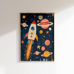 a painting on the wall of a room with a rocket ship and planets in space