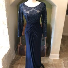 Incredible Navy Blue Formal Gown. Lace And Sequin Overlay And Bodice, Back And Sleeves. Flattering Pleats At Waistline. Full Back Zip. Blue Lace Evening Dress With Long Sleeves, Blue Lace Long Sleeve Evening Dress, Blue Long Sleeve Lace Evening Dress, Blue Long Sleeve Lace Gown, Royal Blue Long Sleeve Evening Gown, Blue Lace Embellished Gown, Royal Blue Long Sleeve Evening Dress For Formal Occasions, Blue Lace Long Sleeve Mother Of The Bride Dress, Blue Long Sleeve Lace Mother Of The Bride Dress