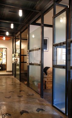 the inside of a building with glass doors