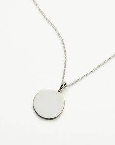 Engravable Round Necklace | Sterling Silver. Make It Personal with a Necklace. Paired with a Delicate Chain, the Smooth Clip-On Pendant Can be Engraved on Both Sides – the Perfect Gift for that Special Someone. Opt for the Engravable Round Disc Pendant. Please Note: Engraving Items May Take 7-10 Working Days to Process. Pendant Metal: Sterling Silver Pendant Dimensions: 15mm Short Plain Chain: Total Length 450mm with Extension Links at 410mm, 430mm and 450mm Weight: 4. 3 Gproduct Code: En-S-N1-N Double Chain Bracelet, Fan Necklace, Malachite Necklace, Leaf Bracelet, Round Necklace, Star Earrings Stud, Disc Pendant, Delicate Chain, Coin Necklace