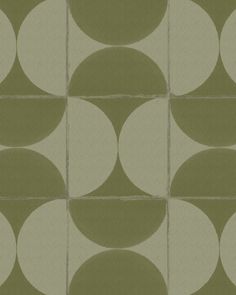 a green and white tiled wall with circles on it