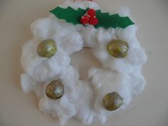 a christmas wreath made out of cotton balls