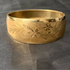 Beautiful Floral Design. 18k Gold. 23.22 Grams. Fits A 6.5” Wrist. 1” Wide Face. .5” Back. Classic Etched Gold Bracelet For Formal Occasions, Elegant Etched Bangle For Formal Occasions, Elegant Etched Yellow Gold Bangle, Etched Bangle For Wedding, Vintage Gold Bracelet For Formal Occasions, Elegant Etched Gold Bracelet For Weddings, Heirloom Style Gold Bracelet, Heirloom Style Hallmarked Gold Bracelet, Antique Gold Bracelet For Formal Occasions