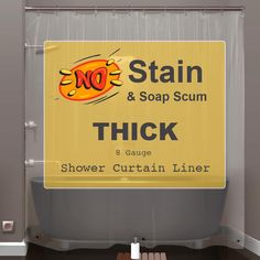 there is a sign on the shower curtain that says, stain & soap scum thick