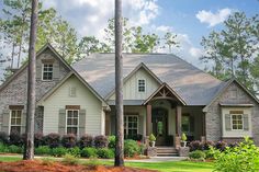 a large house with lots of trees in front of it