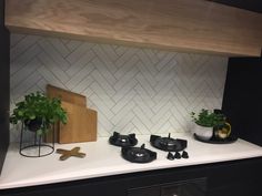 the kitchen counter is clean and ready to be used as a shelf for cooking utensils