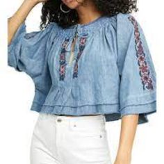 Floral Embroidery Adds Charm And Texture To This To From Free People, Accented With Elbow-Length Flare Sleeves And A Split Neckline. Product Details Pullover Split Neck With Tie Elbow Flare Sleeves Imported Measurements Shown In The Pictures Summer Cotton Blouse With Tonal Embroidery, Spring Denim Blue Tops, Summer Embroidered Blue Denim Top, Floral Embroidered Denim Top For Summer, Summer Denim Top With Floral Embroidery, Spring Bohemian Cotton Embroidered Top, Spring Bohemian Embroidered Cotton Top, Blue Denim Top With Floral Embroidery For Spring, Spring Bohemian Denim Blouse