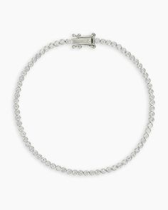 Achieve a truly timeless look with the Classic Diamond Tennis Bracelet. This gorgeous solid white gold tennis bracelet features a classic, diamond encrusted design that is perfect for any occasion. To wear, stack alongside other white gold or diamond bracelets. More is more! Classic Diamond Tennis Bracelet in 14k Solid White Gold/6, Women's Size 6 in. by gorjana Luxury Sterling Silver Tennis Bracelet With Diamond Accents, Classic White Gold Diamond Bracelet With Pave Setting, Classic Formal Tennis Necklace With Pave Setting, Elegant Diamond Tennis Bracelet With Pave Setting, Classic Cubic Zirconia Diamond Bracelet With Pave Setting, Classic Cubic Zirconia Bracelet With Pave Setting, Anniversary Tennis Bracelet With Pave Setting In Platinum, Classic Tennis Necklace With Pave Setting For Anniversary, Anniversary Platinum Tennis Bracelet With Pave Setting