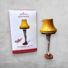 a lamp that is sitting next to a box