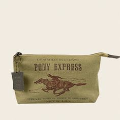 "Pony Express Advertisement Poster Cosmetic American Glory are meticulously handcrafted Handbags & Accessories inspired by history. Advertising, packaging, posters and ephemera from the early 20th Century are nostalgic and gives a connection to America's past. Giddy Up--because you've got an easy-to-grab pouch filled with all your essentials. This practical pouch holds your travel must-haves from shaving cream and hair products to moisturizers, sunscreen and your bathroom essentials. The pri Handcrafted Handbags, Pony Express, Canvas Leather Bag, Travel Must Haves, Vintage Packaging, Advertising Poster, Canvas Leather, Cosmetic Bag, Burlap Bag