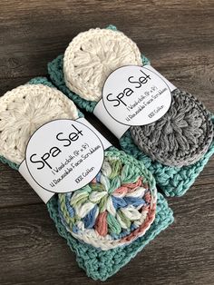 three crocheted coasters with labels on them