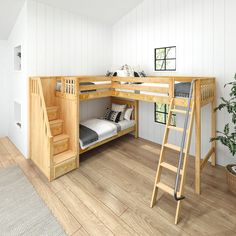 a loft bed with stairs leading up to it and a ladder in front of the bed