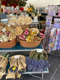 baskets filled with flowers on top of a table