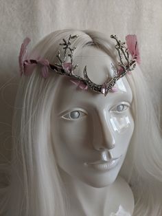 This gorgeous woodland tiara features pink leaves surrounding the naturally wrapped base, and a gorgeous moon and branches decorating the center. A matching pink gem is set in the middle of the moon and large pink ombre leaves decorate the sides. Perfect for any occasion you choose or to add a magical touch to your everyday! Choose between silver charms as pictured or bronze! Whimsical Pink Crown Headpiece, Pink Whimsical Headband Headpiece, Pink Crown Headpiece For Wedding, Pink Wedding Crown Headpiece, Whimsical Pink Headpieces As Gift, Whimsical Pink Headpieces For Gifts, Handmade Pink Headpiece As A Gift, Pink Headband Gift Headpieces, Pink Adjustable Handmade Headpiece