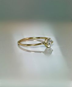 Simple and unique Floating Stone Ring. This ring is Extremely cute and Dainty also for stacking, thumb or midi and a great addition for your collection or as a perfect gift. --Great for Baby/kids as birthstone Rings. --14k/10k Real Solid Gold --Band Thickness: 1.0mm --CZ approx : 3mm wide = 0.10 ctw --Diamond Option: Natural .10 ct Si quality ** Limited time SALE ** Order Yours Today Please message me for larger size! SALE!! Great Value! **Dainty Rings On SALE Now** **100% Quality Guaranteed** - Modern Birthstone Ring With Single Diamond For Promise, Modern Birthstone Ring With Prong Setting For Promise, Modern Promise Ring With Prong-set Birthstone, Minimalist Solitaire Birthstone Ring For Anniversary, 14k Gold Solitaire Bypass Promise Ring, Solitaire 14k Gold Bypass Promise Ring, Adjustable Solitaire Birthstone Ring For Everyday, Minimalist Birthstone Ring With Prong Setting For Anniversary, Everyday 14k Gold Birthstone Ring With Diamond