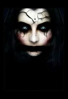 an evil woman with blue eyes and black makeup