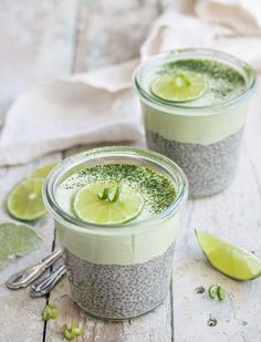 two glasses filled with chia pudding and limes