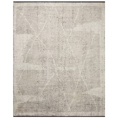 a rug with an intricate design on the front and back side, in grey tones