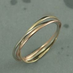 Now our popular rolling rings are available in solid 10K gold! Each band in this petite interlocking set measures 1mm wide by .5mm thick--petite enough that you will hardly know you are wearing them. Your ring will be handmade in three colors of solid 10K gold--white, yellow and rose. It will be made to size and be either high polished or given a soft brushed finish. Please don't hesitate to contact us with any questions or concerns. We are a small family business that prides itself on our quali Rolling Ring, Russian Wedding, Triple Ring, Wedding Ring Diamond Band, Spinning Rings, Palm Coast, Bridal Bands, Rings Simple, Diamond Wedding Rings