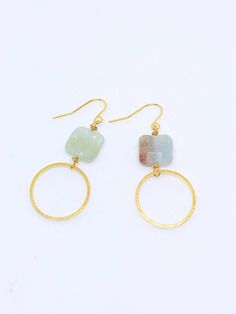 Handmade in Portland, Oregon. This will make the perfect gift! Or, definitely get it for yourself, I support that, too. MEASUREMENTS + MATERIALS - Length is about 1.5 inches - Pretty raw aquamarine gemstone - Hoop is about 1 inch in diameter - Gold fill ear wire for sensitive skin (hypoallergenic) WHAT PEOPLE SAY “Beautiful craftsmanship, these were for my mother in law, she loves them. I love supporting small businesses.” - Josh “ Love these earrings!! I get so many compliments about them when Handmade Gold Aquamarine Earrings, Modern Gemstone Hoop Earrings For Gift, Modern Gemstone Hoop Earrings As Gift, Minimalist Gold Aquamarine Jewelry, Gold Aquamarine Gemstone Earrings, Aquamarine Round Jewelry With Matching Earrings, Handmade Aquamarine Round Jewelry, Aquamarine Matching Earrings Jewelry, Gold Aquamarine Round Jewelry