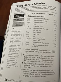 an open recipe book showing the ingredients for chewy ranger cookies