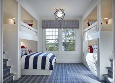 an image of a bedroom with bunk beds on the wall and blue carpeted floor