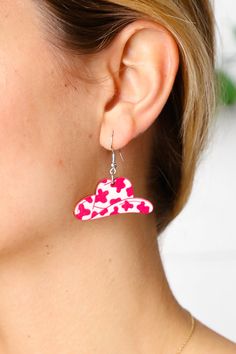 Add casual chic to your accessory ensemble with these pink wooden cow print hat earrings with a striking paint design. A must have for your summer closet!      ONE SIZE FITS ALL Width: 1.5 inch Height: 2 inches Wood / Polyester Lead Compliant Earrings Type: Dangle Imported Weight: .198 Lbs Cow Print Hat, Rhinestone Slides, Unique Pendant Necklace, Summer Closet, Paint Design, Open Hoop Earrings, Faux Leather Belts, Shoe Gifts, Black Chain