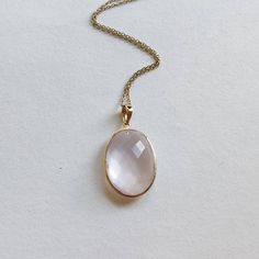 ITEM DESCRIPTION: >>The pendant is made from Solid 14K Yellow Gold. Gemstone used is absolutely natural and ethically sourced. >>Natural Rose Quartz in briolette cut and oval shape with bezel setting is studded on it with utmost precision. >>This is a minimalist design and is absolutely hassle-free and everyday jewelry. Gem: Rose Quartz Gem size: 16x22 mm oval Gem weight: 14.85 carats Gold purity: 14K (58.33% approx.) Gold weight: 0.58 grams Gross weight: 3.55 grams The Gold purity is guaranteed Delicate Oval Rose Gold Jewelry, Oval Rose Gold Jewelry With Birthstone, Elegant Pink Gold Jewelry With Bezel Setting, Oval Rose Cut Diamond Jewelry In Rose Gold, Oval Pink Gold Fine Jewelry, Oval Pink Gold Jewelry For Anniversary, Oval Pink Gold Jewelry For Anniversaries, Rose Gold Oval Cabochon Jewelry For Anniversary, Pink Oval Jewelry With Bezel Setting