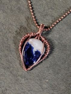 This is a Handmade Wire Wrapped Copper and Sodalite Pendant   Gift Box or Velvet Bag Available for $1.00 $4.75 Shipping to all 50 U.S. States With Tracking. Actual Shipping Costs Me $5 at the Minimum for 1 Single Item and I Pay the Difference. -Please Read before Ordering- The kinds of metals (Sterling Silver, Copper, Brass) used in the jewelry I make are left natural (unsealed) and will develop a natural patina overtime. Metal oxidizes over time when it comes in contact with oxygen in the environment and skin. For many people the acids in your skin combine with the metal and make copper or silver salts which are greenish or gray. They are harmless and just wash off. Handmade Wire Wrapped, Baltimore Md, Handmade Wire, Velvet Bag, Baltimore, Wire Wrapped, Wire Wrapping, Jewelry Necklace Pendant, Patina