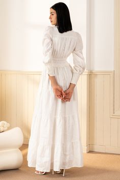 FINAL SALE! NO RETURNS. NO EXCHANGES. Georgia Maxi Dress will make a lasting impression at your next spring event! With an elastic waist, long sleeves, and tiered peasant skirt. LENGTH: 52" from top of shoulder FABRICATION: 100% White Linen STYLE#;DR-21450 White Linen - WHITE-S24 *Dry Clean or wash on cold and hang flat to dry *Model is wearing size XS White Dress Modest, Modest Winter Dresses, Graduation White Dress, White Peasant Dress, Classy White Dress, Linen Gown, Celtic Dress, White Dress Winter, White Dress Outfit