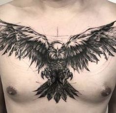 the chest is covered in black ink with an eagle tattoo on it's chest