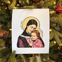 a christmas ornament with an image of the mother and child on it