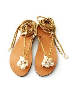 Hey, I found this really awesome Etsy listing at https://www.etsy.com/listing/727640471/sea-shells-pearls-rope-sandals-wedding Elegant Handmade Beach Sandals, Gold Sandals For Summer Beach Wedding, Cream Single Toe Strap Sandals For Beach, Handmade Ankle Strap Sandals For Beach Wedding, Beach Season Wedding Ankle Strap Sandals, Ankle Strap Sandals For Beach Season Weddings, Adjustable Sandals For Summer Destination Wedding, Adjustable Sandals For Destination Wedding In Summer, Beach Wedding Open Toe Sandals