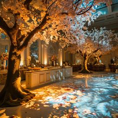 a large room with tables, chairs and trees in blooming petals on the floor