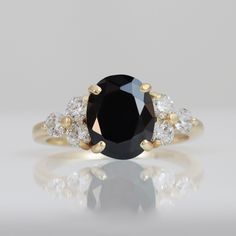 Don't miss this opportunity to own this beautiful gemstone ring! => Gemstone Type - Onyx, Clear Quartz => Gemstone Cut - Faceted => Gemstone Size - 8*10 mm, 3 mm => Total Number of Gemstones - 7 => Metal Type - 14k Gold Filled (Tarnish Resistant and Nickel Free) - also available in 925 sterling silver and 14k solid gold * Please contact me for pricing on sizes larger than 11 * ~ Feel free to ask me about custom made designs. ❏ Replacements and custom orders: ✪ 925 sterling silver - no additional Black Oval Diamond Ring For Anniversary, Black Oval Rings For Anniversary, Black Oval Anniversary Ring, Heirloom Black Ring With Center Stone, Black Heirloom Ring With Center Stone, Classic Oval Black Spinel Jewelry, Black Oval Jewelry With Center Stone, Black Oval Center Stone Jewelry, Black Oval Sapphire Ring With Center Stone