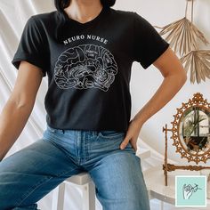 a woman sitting on a chair wearing a black shirt with the words canadian care unit printed on it