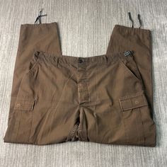 Vintage 2000s Propper Loose Fit Multiple Pocket Military Style Basic Essential Brown Trouser Pants 35 Waist Mens Condition:  Excellent Used Condition  = No Flaws Measurements: Please see photos above for all measurements IF YOU BUY TWO OR MORE ITEMS USE THE CODE BUNDLE @ CHECK TO SAVE 20% WE SHIP WITHIN 24 HOURS AFTER PURCHASE! Please be aware that we do not offer free returns!! The Buyer is responsible for the cost of the return label. Follow us on TikTok & Instagram @findsnostalgic and tag us Vintage Cargo Pants With Cargo Pockets For Outdoor, Military Style Brown Pants With Pockets, Brown Military Style Pants With Pockets, Brown Military Pants With Pockets, Military Style Hiking Pants With Pockets, Military Style Brown Bottoms With Pockets, Utility Cargo Pants With Belt Loops For Hiking, Khaki Cargo Pants With Belt Loops For Hiking, Vintage Outdoor Bottoms With Cargo Pockets