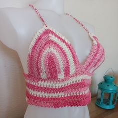 This handmade Pink Crochet Top combines style and functionality. Featuring vibrant pink tones, this Granny Square Top is perfect for summer festivals, beach parties, sports, yoga, pilates, and everyday wear. It's durable enough to accompany you through both summer and winter. Made from a blend of cotton and acrylic yarn, this Cotton Crochet Knit Top offers softness and breathability, helping to prevent sweating. Designed with elegant details for those who embrace the boho style, this Crochet Hal Pink Fitted Crochet Top, Handmade Fitted Crochet Top, Fitted Pink Crochet Top, Handmade Fitted Crochet Yarn Top, Pink Bohemian Crochet Cotton Top, Fitted Crochet Cotton Top, Pink Fitted Crochet Crop Top, Handmade Fitted Crochet Cotton Top, Handmade Fitted Crochet Top In Cotton Yarn