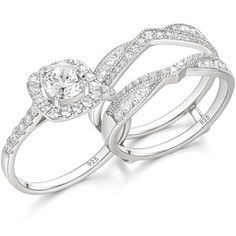 two white gold wedding rings with diamonds on each band and an oval shaped diamond in the center