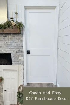 a white door in front of a brick fireplace