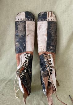 an old pair of shoes with laces on them