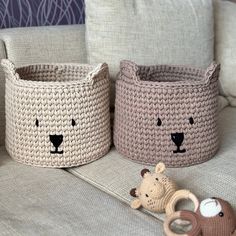 two crocheted baskets with teddy bears on the floor next to eachother