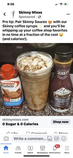 a cup of coffee with whipped cream on top and some other items next to it