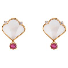 Rossella Ugolini Deco Collection, Deco Style 18 Karats Yellow Gold Oval Cut 1,60 Carats Rubies, Rock Crystal 0.12 Carats White Diamonds Stud Earrings. Classy and elegant Stud Earrings Handcrafted with a frosted fan shape Rock Crystal on lobo set on a bezel made in 18 karats Yellow Gold and two White Diamonds. This part could be adapted for a clip-on earrings. Fan shape suspends an oval cut 1,60 Carats Red Ruby. Deco-inspired takes on the style—with a touch colorful options for the truly elegant Crystal Stud Earrings, Oval Cut Diamond, Red Ruby, Rock Crystal, White Diamonds, Deco Style, San Valentino, Diamond Earrings Studs, Diamond Studs