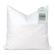 the white down pillow has a tag on it that says synthetic down 22x23