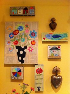 several different pictures on the wall with flowers and hearts