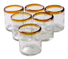 six glasses with brown rims are lined up