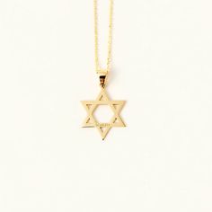 1- PRODUCTION ∙ D E S C I P T I O N Celebrate your faith and elegance with this 14K Solid Gold Star of David Necklace, featuring a striking, exquisitely crafted Star of David pendant that adds a touch of spirituality and sophistication to your style. This elegant necklace is a precious and meaningful accessory that symbolizes your beliefs, making it the perfect gift or beautiful addition to your jewelry collection. 2- PRODUCT ∙ D E T A I L S Gold material: 14K solid gold Gold color option: Yello 14k Gold Star Of David Jewelry For Anniversary, Formal 14k Gold Star Of David Necklace, 14k Gold Celestial Star Of David Jewelry, 14k Gold Star Of David Necklace Gift, Classic Yellow Gold Star Of David Jewelry, 14k Yellow Gold Star Of David Necklace, Luxury Elegant Star Of David Necklace, Gold Star Of David Spiritual Necklace, Yellow Gold Star Of David Necklace