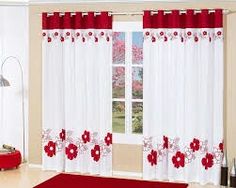 a living room with red and white curtains